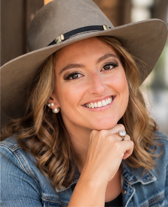 BriAnn in a denim jacket and wide-brimmed hat